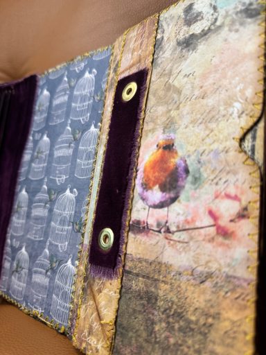 Handmade junk journal cover with colorful bird motif, textured mixed media design, Golden Spine Studio