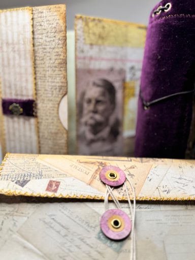 Handmade junk journal "Maud Undone" with string closure, vintage portrait and purple accents, Golden Spine Studio.